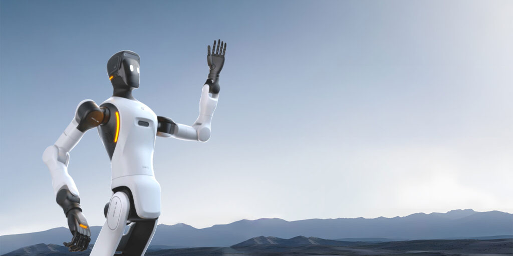 An Agibot humanoid robot raising one arm in a wave, set against a mountain landscape.
